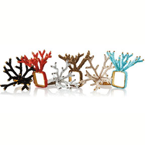 Chic and unexpected, Kim Seybert's coral napkin rings feature a square base, and are entirely beaded by hand.    Available in six colors, they are perfect for adding a splash of color year-round.